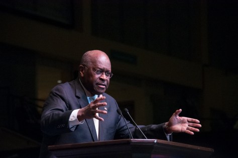 LESLIE ANNE GRAHAM Macon, GA 11/30/2015: "Why am I here? Because Donald Trump asked me to be" stated Herman Cain as he addressed the crowds, endorsing Donald Trump's presidential campaign, at the Macon Centreplex on Monday, November 30, 2015. 